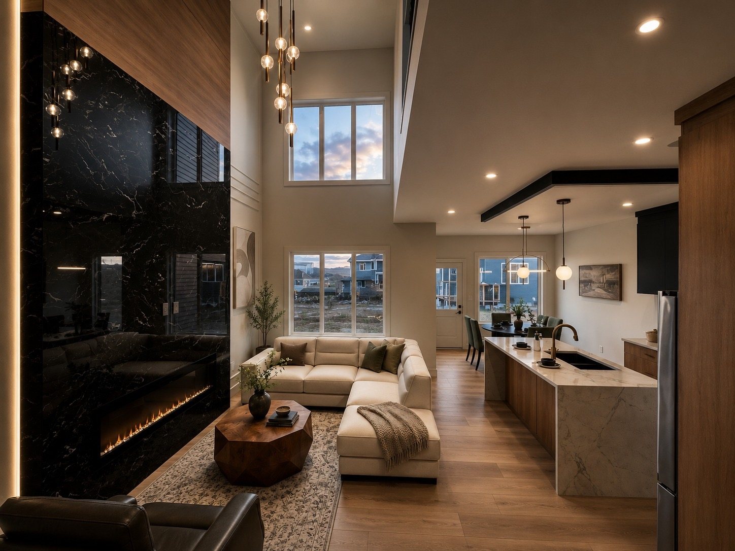 Kapish Homes two-storey great room with a black marble fireplace
