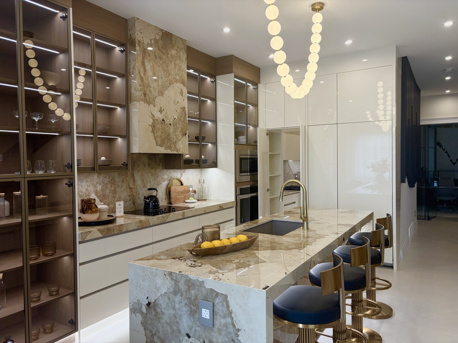 Designer kitchen with a marble waterfall island
